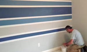 If you're looking for a quick and easy way to add some interest to your basement wall, try painting stripes!