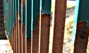 Prepare the wrought iron fence for painting