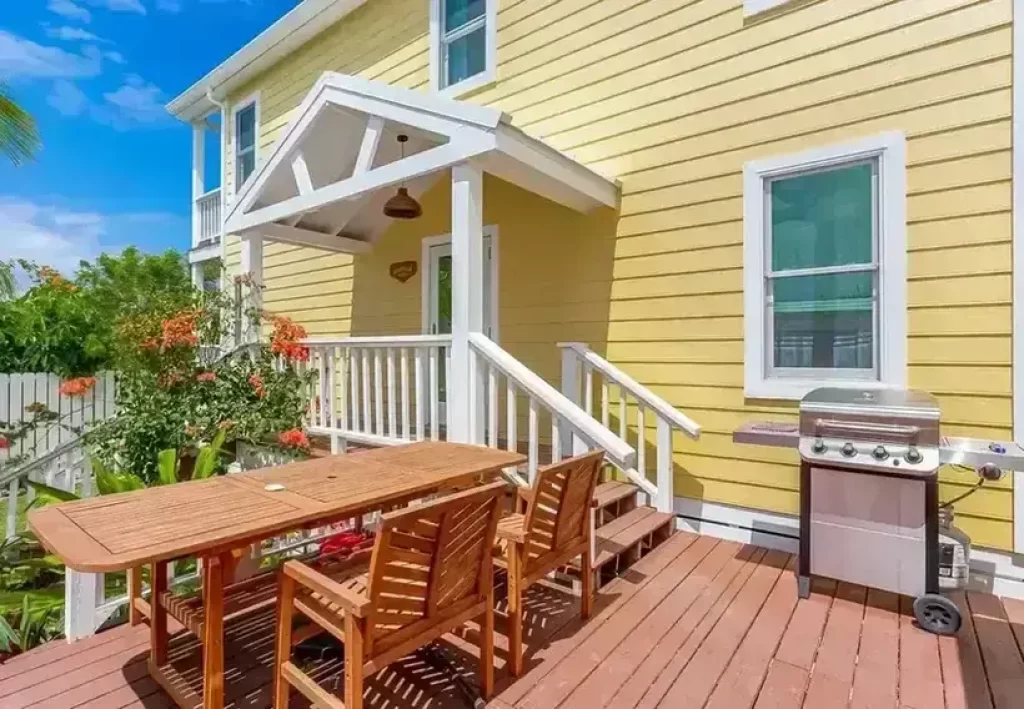  3. Yellow house with a red deck: