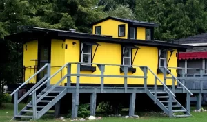 Yellow house with a gray deck